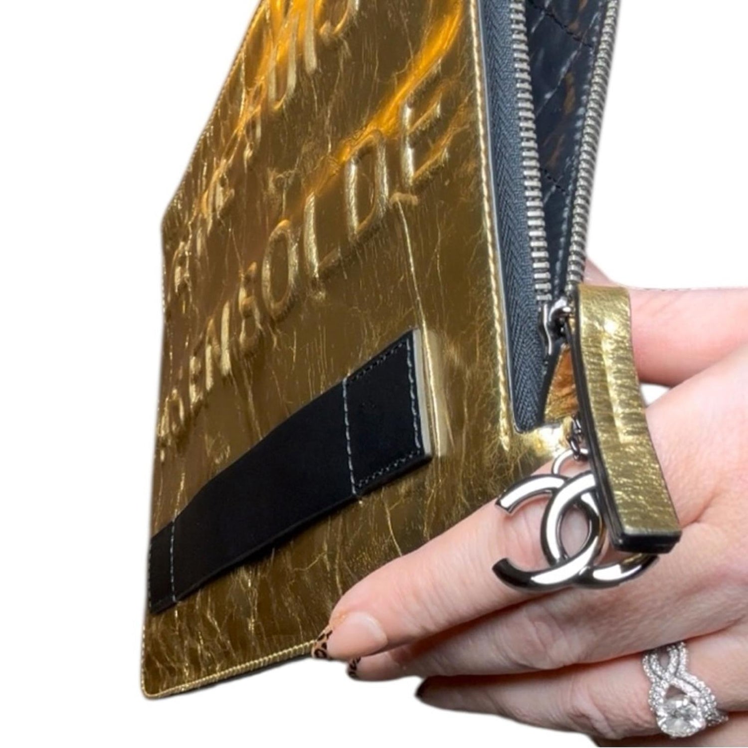 Chanel "Je Ne Suis Pas En Solde" clutch bag in gold metallic crinkled leather