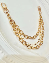 Gold Tone and Rhinestones Handbag Charm Chain layered with gold tone hardware