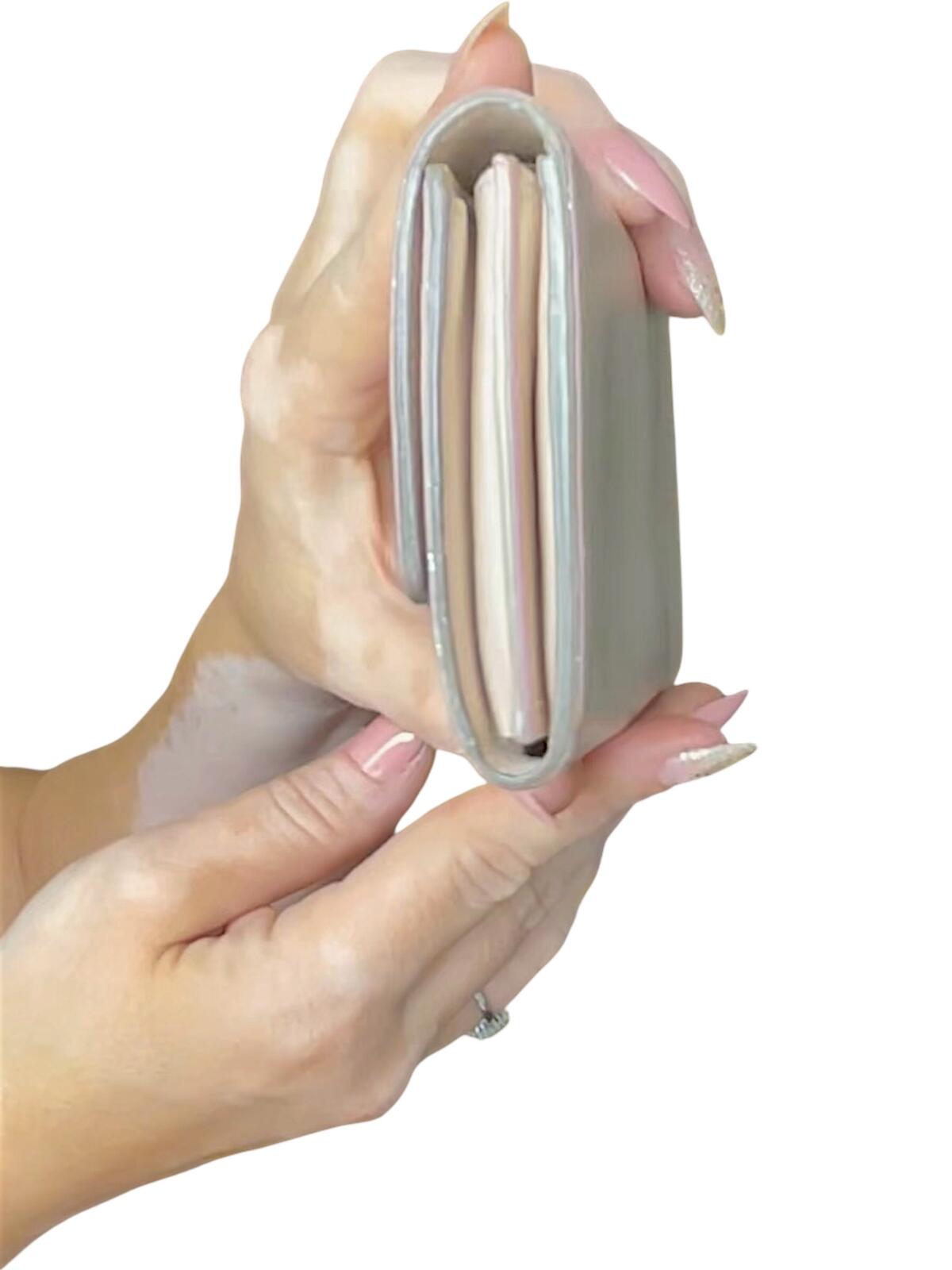 Salvatore Ferragamo Ivory Leather Wallet with Bow Detail