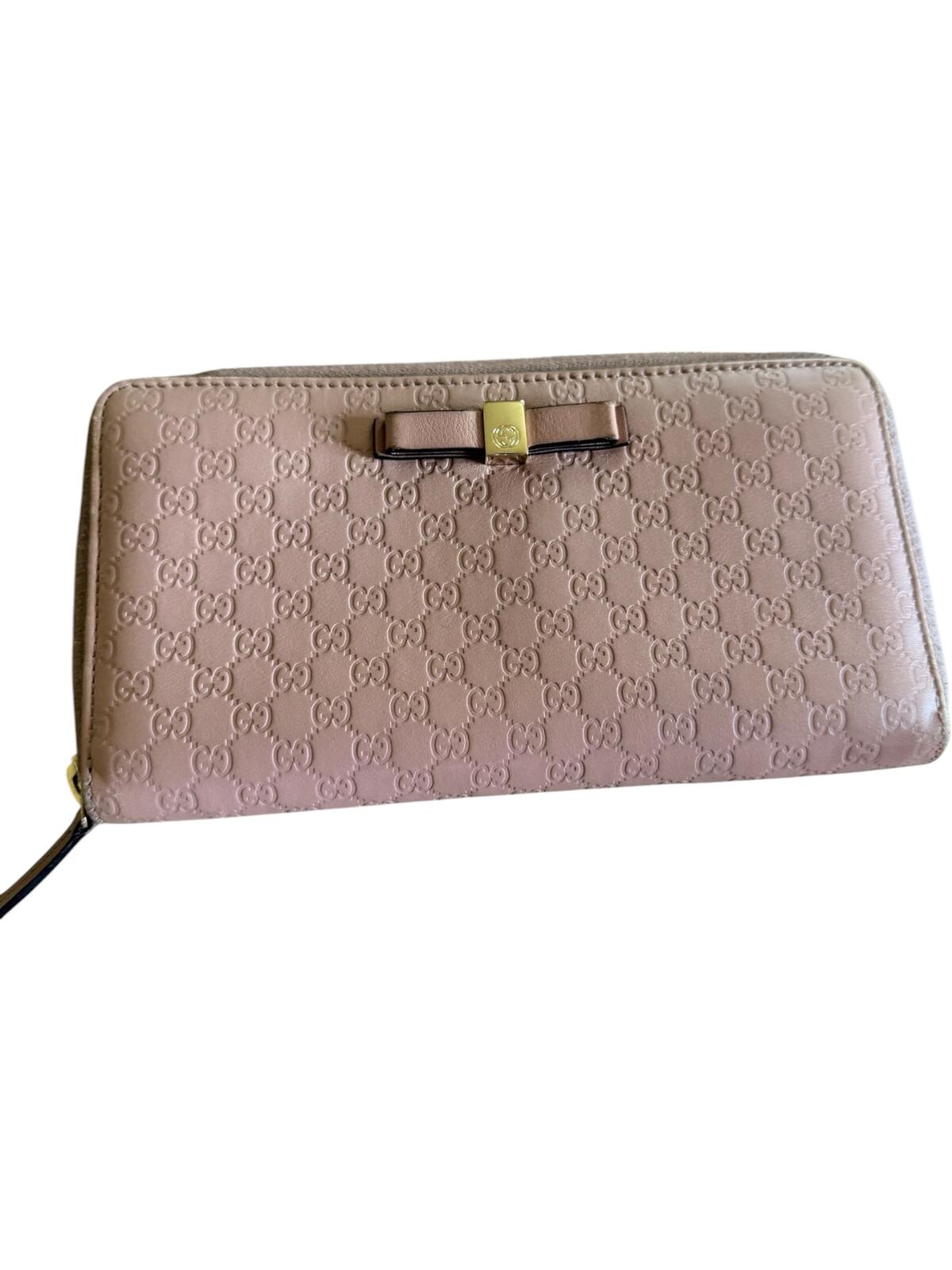 Gucci Pink Microguccissima Bow Wallet Embossed Leather Zip-Around