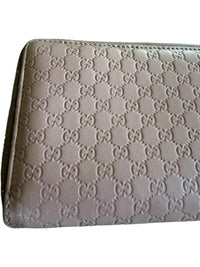 Gucci Pink Microguccissima Bow Wallet Embossed Leather Zip-Around