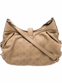 YoloLuxe Handbags beige perforated leather hobo bag with monogram pattern, gold-tone hardware, and adjustable strap.