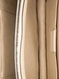 Interior view of YoloLuxe Handbags Gucci bamboo bag featuring beige fabric lining and a secure zippered compartment.