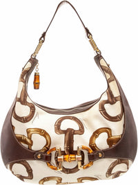 YoloLuxe Handbags Gucci bamboo print canvas hobo bag with brown leather trim and signature bamboo hardware accents.