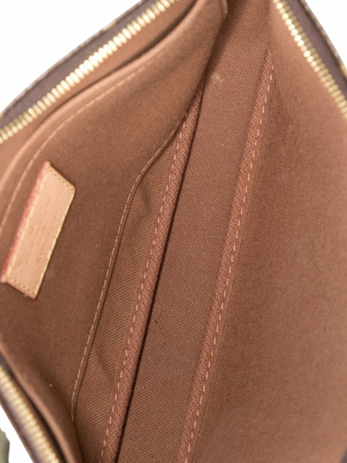 YoloLuxe Handbags Louis Vuitton Multi Pochette interior featuring brown textile lining and gold hardware details.