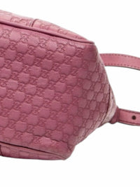 YoloLuxe Handbags pink Gucci Guccissima embossed leather tote bag with signature monogram pattern and side detail