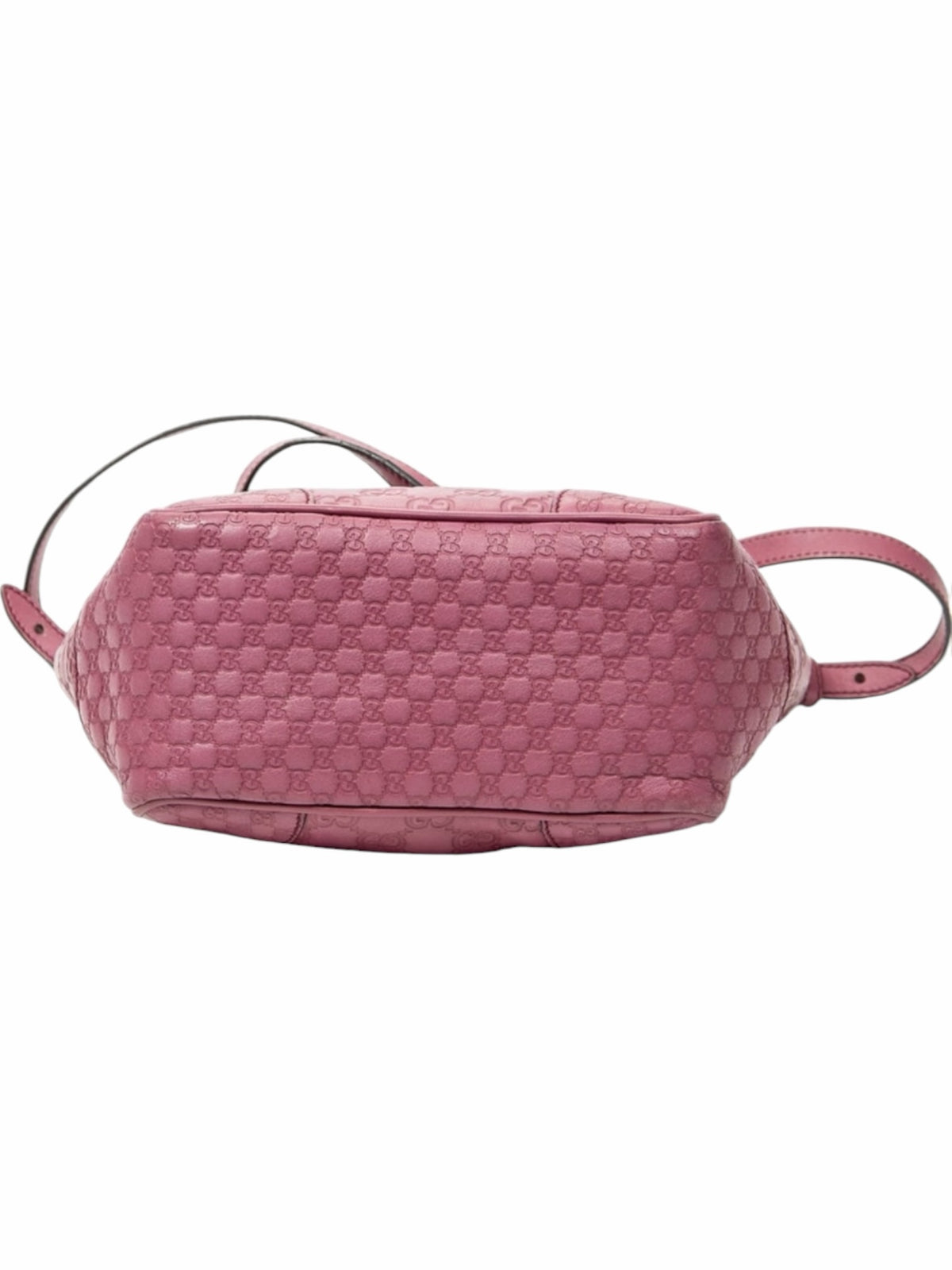 YoloLuxe Handbags pink Gucci Guccissima embossed leather tote bag showing the structured base and monogram pattern