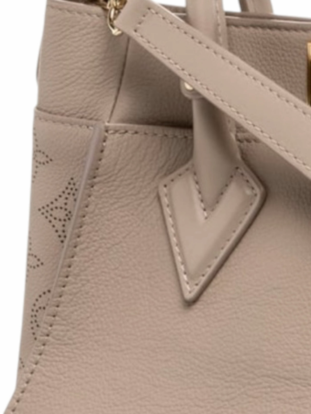 YoloLuxe Handbags taupe leather handbag with perforated Monogram side detail and gold-tone hardware.